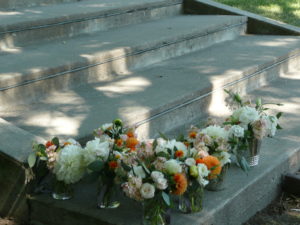 Another artful shot of the aisle flowers linihg the staircase the bride will use for her exit.